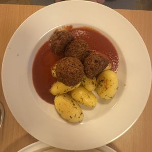 Veg Balls, tomato sauce and potatoes   at Napfényes Restaurant & Confectionery in Budapest