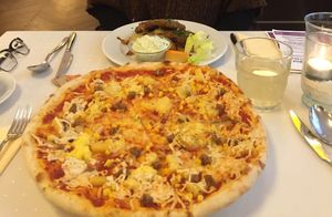 Pizzas are huge! at Napfényes Restaurant & Confectionery in Budapest