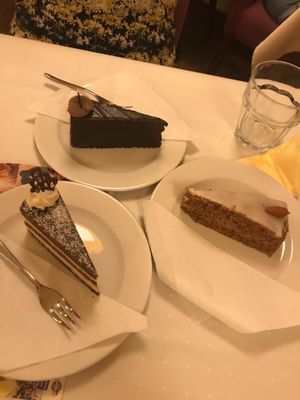 A selection of the cakes on offer - bounty cake, chocolate torte and carrot cake at Napfényes Restaurant & Confectionery in Budapest