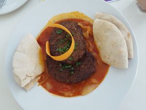 Daily special of ratatouille stew with vegan burger patties and pita bread at Napfényes Restaurant & Confectionery in Budapest