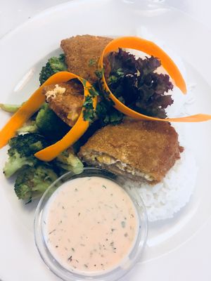 Seitan with rice and steamed broccoli  at Napfényes Restaurant & Confectionery in Budapest
