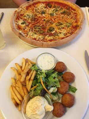 Jalapeno pizza and falafel platter  at Napfényes Restaurant & Confectionery in Budapest
