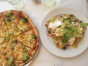 Pizza and layered potatoes  at Napfényes Restaurant & Confectionery in Budapest
