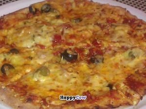 Delicious pizza at Napfenyes Etterem. at Napfényes Restaurant & Confectionery in Budapest