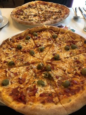 Pizza with three kinda of cheese! Quite average. at Napfényes Restaurant & Confectionery in Budapest