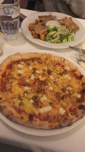 Pizza hawaii and mixed grill with veggies and seitan at Napfényes Restaurant & Confectionery in Budapest