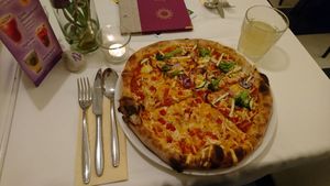 Pizza: half 3-vegan-cheese, half green-lover. at Napfényes Restaurant & Confectionery in Budapest