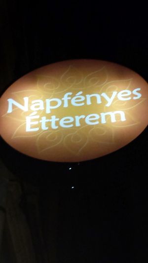 Napfenyes Etterem sign.  Remember it's in a basement/cellar.  at Napfényes Restaurant & Confectionery in Budapest