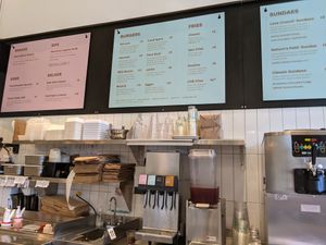 Menu and interior at Planetary Burger in Vancouver