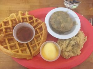 sweet potato waffle with cheese grits and sausage gravy and biscuit  at Souley Vegan in Oakland