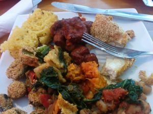 Sampler platter: cornbread, BarBQ tofu, southern fried tofu, black eyed peas, lentils, collard greens, red beans & rice, mac & cheese, yams, fried okra, mashed potatoes & gravy, potato salad at Souley Vegan in Oakland