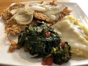 Country fried seitan steaks. Comes with mashed potatoes and collard greens. 🤤   at Souley Vegan in Oakland