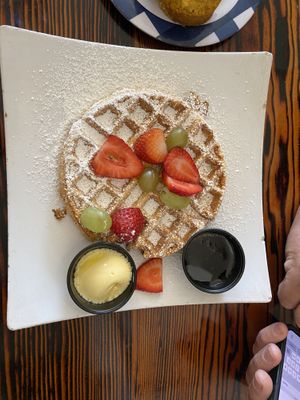 Delicious sweet potato waffle, tofu scramble, “sausage” , fresh fruit. Yum!   at Souley Vegan in Oakland