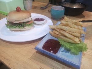 Vegan burger (1.25$) with French fries (1.5$). Not dry at all at Zhu Lin Xuan House in Siem Reap