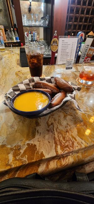 Pretzel dippers with vegan cheese at Queen & Rook Game Cafe in Philadelphia