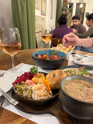 Lobio, tomato salad with jonjoli, house bread, wine. at Salobie Bia in Tbilisi