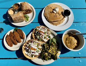 Breakfast burrito, apple crisp pancakes, sausage, tostadas and biscuits and gravy. at Counter Culture in Austin