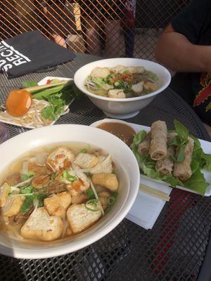 Tofu pho (left) mushroom pho (right) and crispy spring rolls with peanut sauce  at Pho in Cardiff