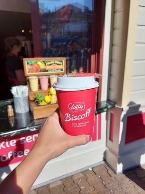 Soy laté with biscoff flavor and a complimentary cookie at Biscoff Coffee Corner in San Francisco