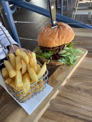 Vegan burger with zucchini fritter   at The Deck in Forster