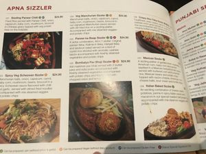 Orange V symbol means can be made vegan at Status in Auckland