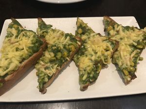 Corn and pesto starter with vegan cheese at Status in Auckland