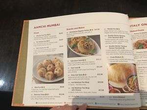 Orange V symbol means can be made vegan at Status in Auckland