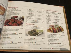 Orange V symbol means can be made vegan at Status in Auckland