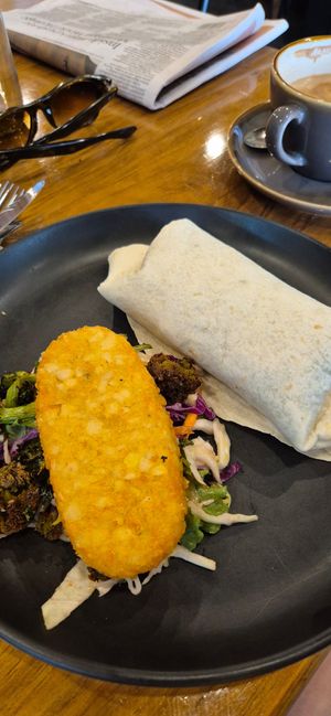 Super delicious breakfast wrap with a hashbrown side at 1Two1 Vegan Café in Springwood
