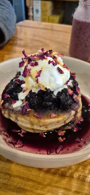 Pancakes with berries and icecream. Yum!! at 1Two1 Vegan Café in Springwood