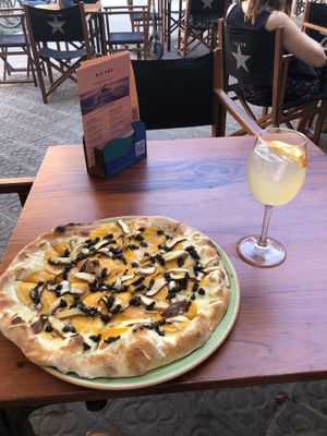 Mushroom and truffle pizza. Kombucha drink.  at Blu Bar in Barcelona