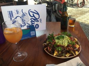 Homemade peach Kombucha, nacho’s and beer. Outside terrace with heating and blankets if needed    at Blu Bar in Barcelona