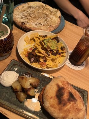 nachos, pulled pork goes happy, cheese lovers pizza (no longer on menu, but i hope they bring it back!!)   at Blu Bar in Barcelona