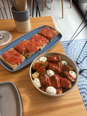 Pan Con Tomate top and Bravas at the bottom   at Blu Bar in Barcelona