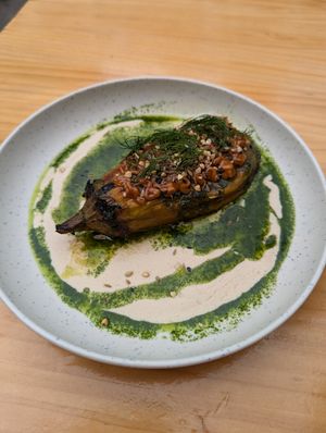 "Berenjena gourmet": roasted eggplant, peanut sauce, tahini sauce, mixed seeds and dill at Blu Bar in Barcelona