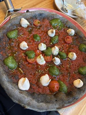 Pizza with pesto and chashew cheese at Blu Bar in Barcelona