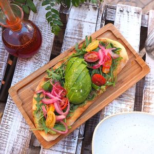 IF YOU LOVE AVOCADO
oval focaccia with avocado, guacamole, cherry tomatoes, onion, pico de gallo and rocket
 at Blu Bar in Barcelona