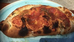 Calzone with homemade vegan ricotta, vegan smoked ham and mushrooms at Blu Bar in Barcelona