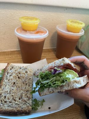 Wellness shot, bright eyes juice, FLT sandwich   at Sugar Apple Organic Cafe in Key West