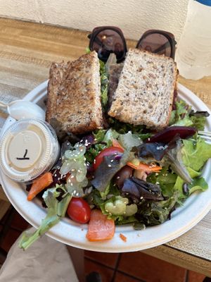 Special fancy hummus sandwich w side salad with tahini dressing on side  at Sugar Apple Organic Cafe in Key West