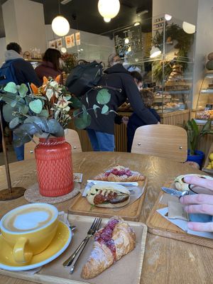 View from table. Vegan raspberry croissant and hummus sandwich  at Dulce de Leche - Boutique San Vicente in Valencia