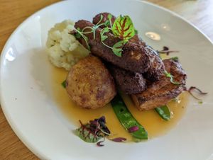 Vegan Sunday roast dinner with vegan sausages at Beck Hall in Malham