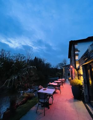 Outside stream side seating   at Beck Hall in Malham