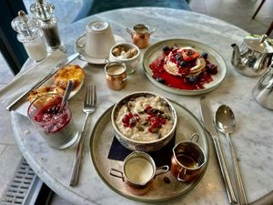 My breakfast buffet - all included in the DB&B rate. Chai porridge, pancakes, chia pudding, pastries, fresh fruit and cereal.  at Beck Hall in Malham
