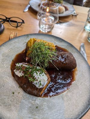 Rib eye seitan 'steak' with hasselback sweet potato and corn cob at Beck Hall in Malham