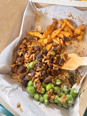 Brazilian black bean with side of fries & peas   at LEON - Pancras Square in North London
