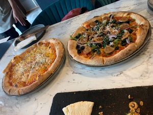 Sausage pizza and cheese pizza at BaganHood 蔬食餐酒館 in Taipei