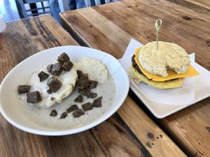 Biscuit and gravy with sausage, breakfast sandwich with sausage, egg, and cheese. Both delicious ! at Sunflower Bakehouse in Nashville