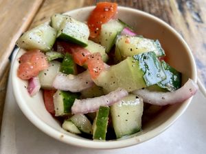 Cucumber tomato salad. Too salty!!  at Sunflower Bakehouse in Nashville