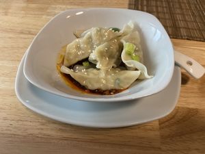 Vegan dumplings in spicy chili sauce at Szechuan Impression in Linz